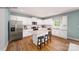Beautiful kitchen features stainless steel appliances, white cabinets and a functional island with barstool seating at 215 Giant Oak Ave, Statesville, NC 28677