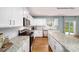 Well-lit kitchen featuring stainless steel appliances, granite countertops, and white cabinetry at 215 Giant Oak Ave, Statesville, NC 28677