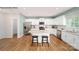 Well-equipped kitchen with white cabinetry, granite countertops, stainless steel appliances, and center island with seating at 215 Giant Oak Ave, Statesville, NC 28677