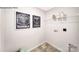 Neat laundry area with decor and a wire shelf for storage solutions at 215 Giant Oak Ave, Statesville, NC 28677