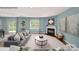 Inviting living room with cozy seating, a fireplace, a view to the backyard, and soothing colors at 215 Giant Oak Ave, Statesville, NC 28677