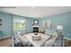 Comfortable living room featuring a fireplace, ample seating, and a view of the backyard through a large window at 215 Giant Oak Ave, Statesville, NC 28677