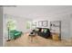 Cozy living room featuring neutral walls and carpet, and ample natural light at 215 Giant Oak Ave, Statesville, NC 28677