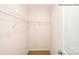 Unfurnished walk-in closet featuring white walls, neutral carpet, and a metal shelving unit on the back wall at 215 Giant Oak Ave, Statesville, NC 28677