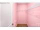 Empty walk-in closet featuring white walls, neutral carpet, and a metal shelving unit on the back wall at 215 Giant Oak Ave, Statesville, NC 28677
