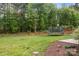 Large, well-maintained backyard with green grass and mature trees at 2336 Beth Haven Church Rd, Denver, NC 28037