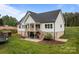 Back exterior showing a spacious yard, deck, and outdoor living space at 2336 Beth Haven Church Rd, Denver, NC 28037