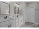 Double vanity bathroom with modern fixtures, hexagon tile flooring, and ample storage for a luxurious feel at 2336 Beth Haven Church Rd, Denver, NC 28037