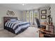 Bright bedroom with a large bed, desk, and natural light from the windows at 2336 Beth Haven Church Rd, Denver, NC 28037