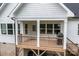 Exterior deck with wooden railings, grill and view of outdoor seating area at 2336 Beth Haven Church Rd, Denver, NC 28037