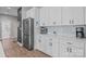 Modern kitchen features stainless steel refrigerator, white cabinets, and granite countertops at 2336 Beth Haven Church Rd, Denver, NC 28037
