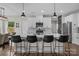 Beautiful kitchen features white cabinetry, marble backsplash, stainless appliances and a spacious quartz countertop island at 2336 Beth Haven Church Rd, Denver, NC 28037