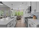 Updated kitchen with stainless appliances, white cabinets, and open view to the dining area at 2336 Beth Haven Church Rd, Denver, NC 28037