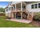 Covered patio with outdoor seating and a view of the lush green lawn at 2336 Beth Haven Church Rd, Denver, NC 28037