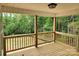 Covered back porch with a view of a lush green forest at 2514 Oak Valley Ln # 4 & 5, Maiden, NC 28650