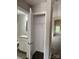 Open closet in hallway next to bathroom featuring a single metal shelf and dark wood flooring at 2514 Oak Valley Ln # 4 & 5, Maiden, NC 28650