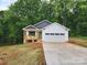 Charming single-story home featuring a welcoming front porch and a two-car garage at 2514 Oak Valley Ln # 4 & 5, Maiden, NC 28650