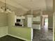 Open kitchen layout with white cabinets, granite counters, and stainless steel microwave and oven at 2514 Oak Valley Ln # 4 & 5, Maiden, NC 28650