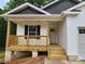 Inviting front porch with wood railing and trim details on a charming new construction home at 2514 Oak Valley Ln # 4 & 5, Maiden, NC 28650