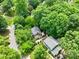 Aerial view of a neighborhood with tree-lined streets and well-maintained homes at 2731 Creekbed Ln, Charlotte, NC 28210