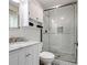 Bathroom featuring subway tile shower with glass door, marble countertop, and sleek fixtures offers modern convenience at 2731 Creekbed Ln, Charlotte, NC 28210