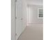 Bright bedroom featuring white walls, carpet floor, and a window providing ample natural light at 2731 Creekbed Ln, Charlotte, NC 28210