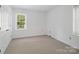 Inviting bedroom with natural light, fresh paint, and neutral carpet, ready for personalization and comfort at 2731 Creekbed Ln, Charlotte, NC 28210