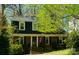 Charming two-story brick home with lush landscaping and a welcoming entrance at 2731 Creekbed Ln, Charlotte, NC 28210