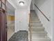 Bright foyer featuring slate floors and a carpeted staircase at 2731 Creekbed Ln, Charlotte, NC 28210
