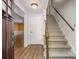A grand foyer welcomes you with hardwood floors, a staircase, and a view into the spacious living room at 2731 Creekbed Ln, Charlotte, NC 28210