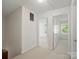Hallway featuring carpet floor and a series of doors that allow access to other rooms at 2731 Creekbed Ln, Charlotte, NC 28210