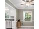 Bright eat-in kitchen featuring stainless steel appliances and gray tiled floor at 2731 Creekbed Ln, Charlotte, NC 28210