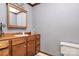 Bathroom featuring vanity with wood cabinets, and toilet at 2780 China Grove Rd, Kannapolis, NC 28083