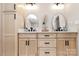 Bathroom featuring double sinks, wood cabinets, and modern fixtures at 2780 China Grove Rd, Kannapolis, NC 28083