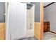 Bathroom featuring a shower with patterned curtain, vanity, and wood paneled walls at 2780 China Grove Rd, Kannapolis, NC 28083