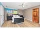 Bedroom featuring unfinished paint, window, black furniture and light wood floor at 2780 China Grove Rd, Kannapolis, NC 28083