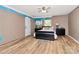 Bedroom featuring unfinished paint, window, black furniture and light wood floor at 2780 China Grove Rd, Kannapolis, NC 28083