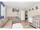 Relaxing bedroom with a comfortable sofa and crib at 2780 China Grove Rd, Kannapolis, NC 28083