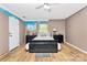 Bedroom featuring unfinished paint, window, black furniture and light wood floor at 2780 China Grove Rd, Kannapolis, NC 28083