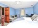 Comfortable bedroom featuring ample natural light, a ceiling fan, and a cozy seating area at 2780 China Grove Rd, Kannapolis, NC 28083