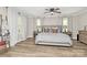 Bright bedroom with neutral tones, a ceiling fan, and large windows at 2780 China Grove Rd, Kannapolis, NC 28083