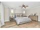 Light-filled bedroom with a plush bed, modern ceiling fan, and serene ambiance at 2780 China Grove Rd, Kannapolis, NC 28083