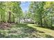 Home with a long porch situated among trees in a scenic, natural setting, providing privacy at 2780 China Grove Rd, Kannapolis, NC 28083