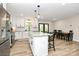 Bright kitchen with a central island and dining area, features modern appliances, and a view of the outdoor patio at 2780 China Grove Rd, Kannapolis, NC 28083