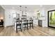 Bright, modern kitchen with stainless steel appliances, farmhouse sink, and island, perfect for culinary enthusiasts at 2780 China Grove Rd, Kannapolis, NC 28083