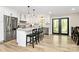 Modern kitchen with stainless steel appliances, granite countertops, and an island with bar seating for casual dining at 2780 China Grove Rd, Kannapolis, NC 28083