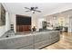 Living room showcasing a cozy brick fireplace and opening to a modern kitchen, perfect for gatherings at 2780 China Grove Rd, Kannapolis, NC 28083