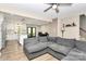 Open-concept living room flowing into a stylish kitchen, perfect for entertaining, exudes warmth and style at 2780 China Grove Rd, Kannapolis, NC 28083