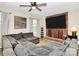 Living room features a cozy brick fireplace with a large sectional couch, creating a comfortable atmosphere at 2780 China Grove Rd, Kannapolis, NC 28083