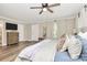Cozy main bedroom with wood floors, neutral walls, a ceiling fan, and lots of closet space at 2780 China Grove Rd, Kannapolis, NC 28083